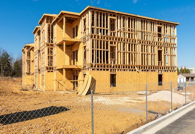 a snapshot of temporary chain link fences protecting a large construction project from unauthorized access in Cooper City, FL